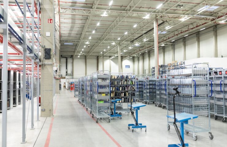 warehouse filled with numerous shelves and racks for storage purposes.